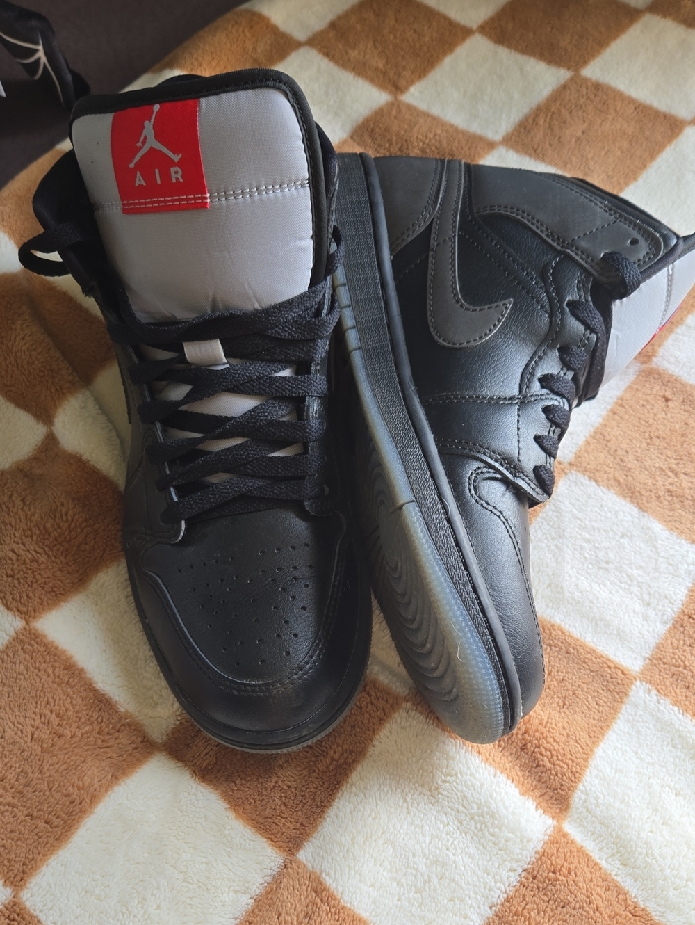 Nike Black and White High-Top Sneakers with Red Tongue Label